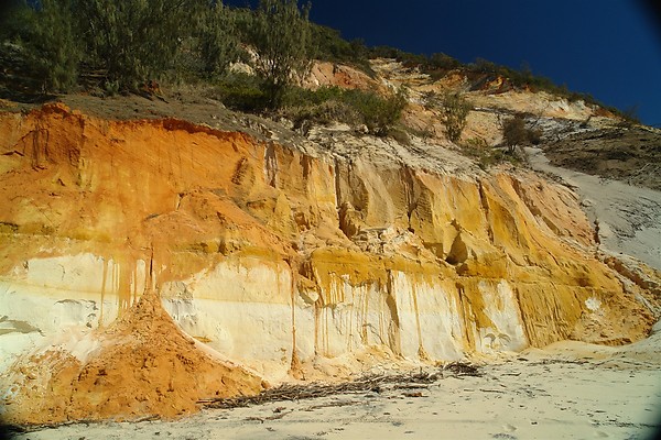 Dreamtime love ends in broken rainbow shards giving new life to the coloured sands.